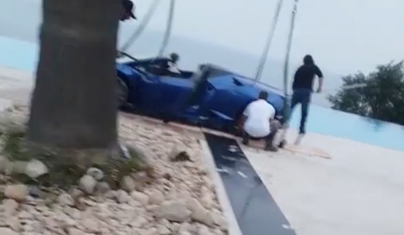 Lamborghini being pulled out of the water